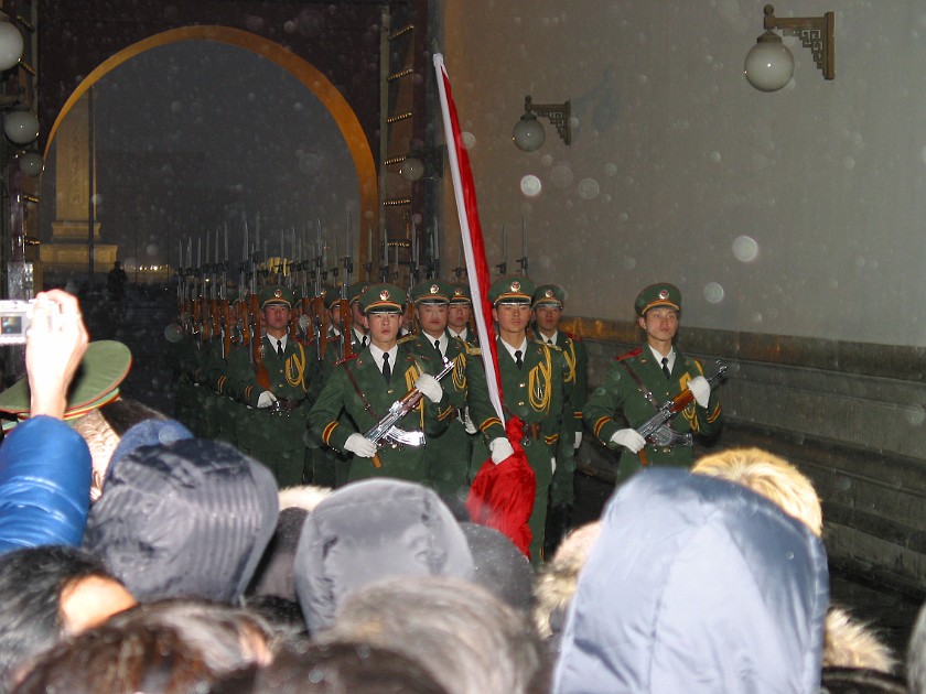 The Forbidden City. PLA Soldiers with Chinese Flag. Beijing. .