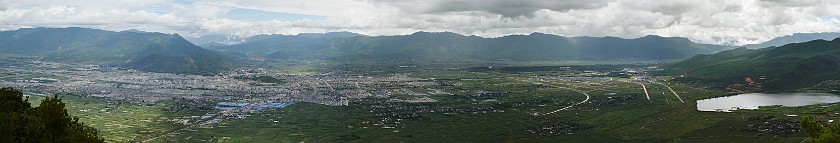 Horseback Ride on Saddle Mountain. View from the top of Saddle Mountain onto Lìjiang. Saddle Mountain. .