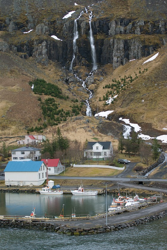 Seyðisfjörður. Water fall and marina. Seyðisfjörður. .