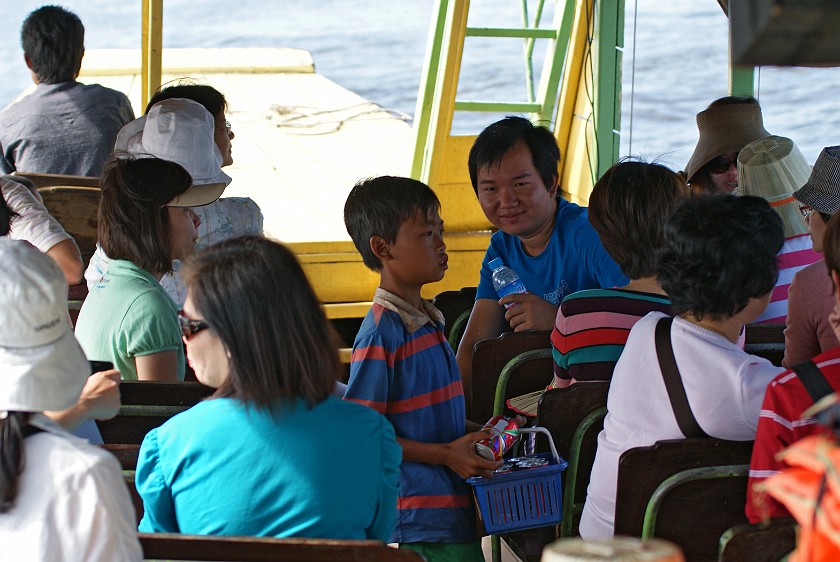 Floating Village of Chong Kneas. Soft Drink Seller on Board. Chong Kneas. .