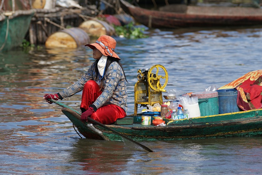 Floating Village of Chong Kneas. Woman on Boat. Chong Kneas. .