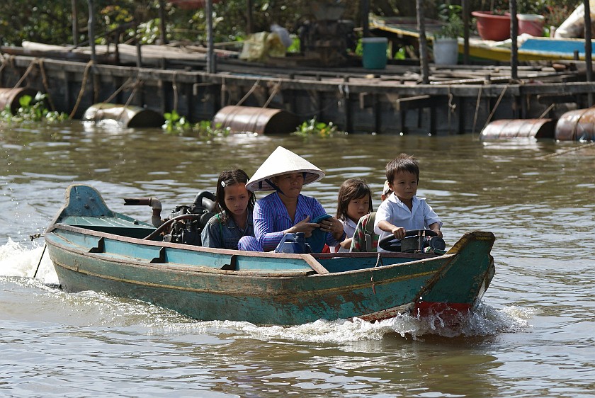 Floating Village of Chong Kneas. Family on Boat. Chong Kneas. .