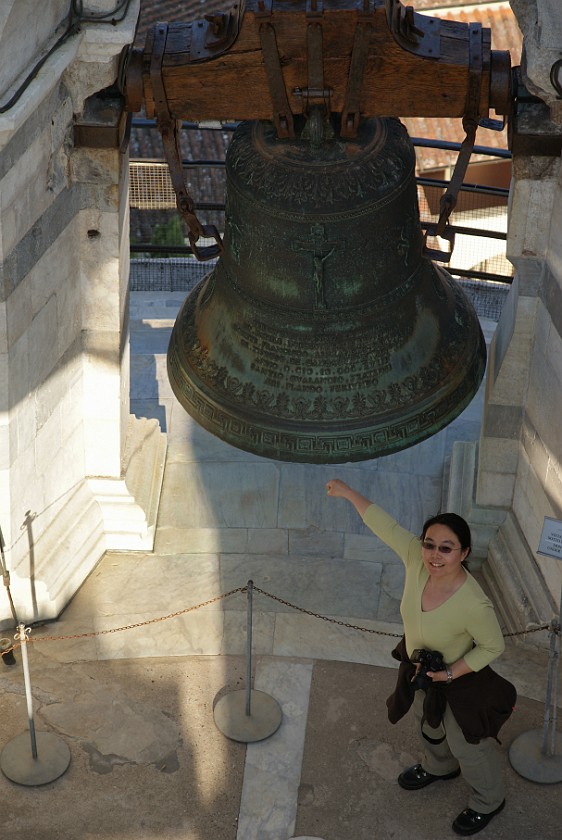 Piazza dei Miracoli at Pisa. Portrait at a Bell on the Leaning Tower. Pisa. .