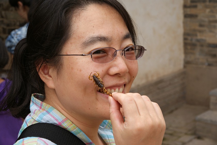 Liquan Yuan Village. Eating a Scorpion. Liquan Yuan. .