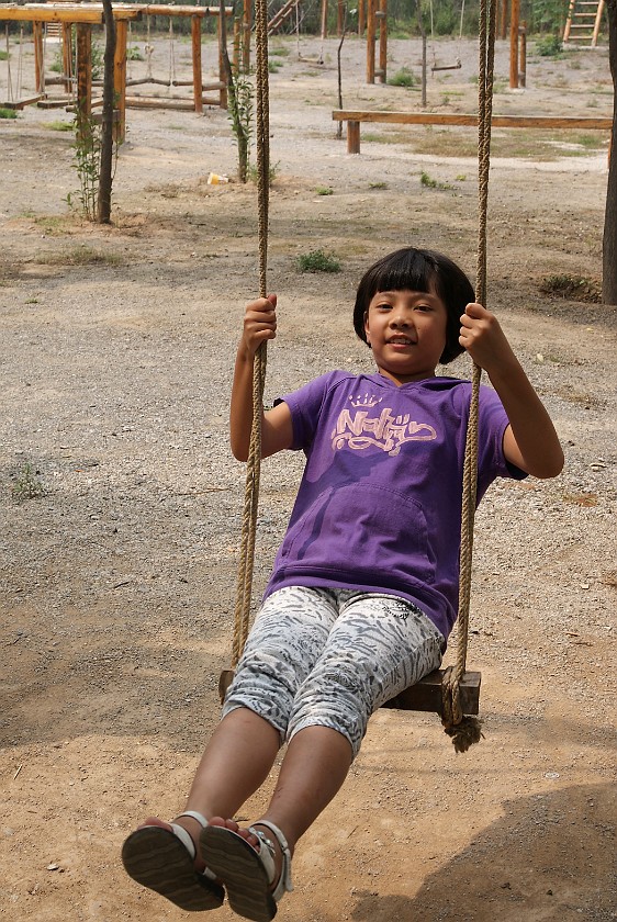 Liquan Yuan Village. Daughter on a Swing. Liquan Yuan. .