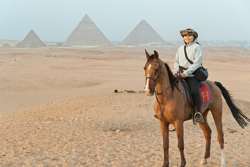 Pyramids of Giza. Portrait on horse back with the Pyramids of Giza in the background. Cairo. .
