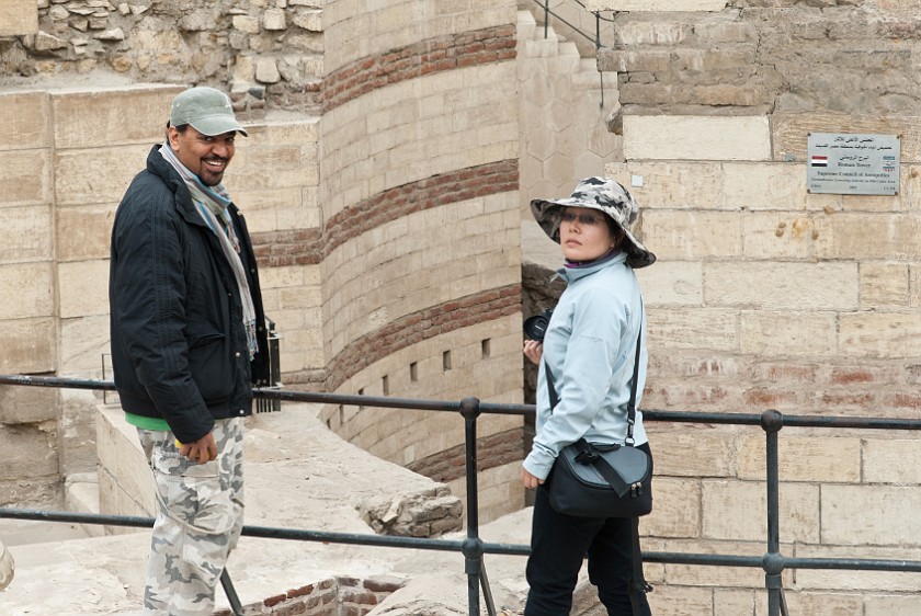 Coptic Cairo. Tour Guide in front of Roman Tower. Cairo. .