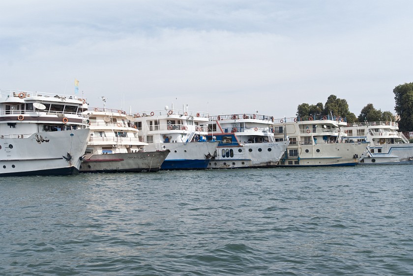 Nile Cruise from Aswan to Luxor. Stack of cruise ships. Luxor. .