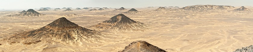 Black Desert Safari. Panoramic view from a mountain peak on the desert. near the Baharyia Oasis. .