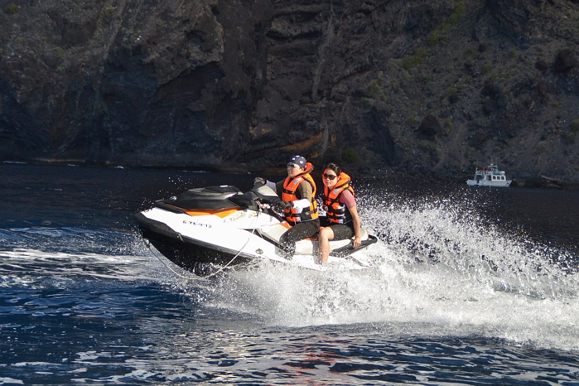 Jet Ski Safari. Jet ski driving in front of the western cliffs of Tenerife. Los Gigantes. .