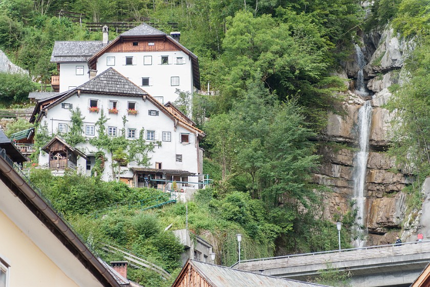Hallstatt. Hillside houses near waterfall. Hallstatt. .