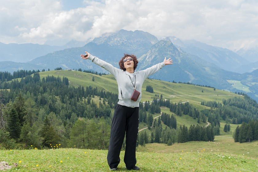 Zwieselalm. Portrait of friend on the Sonnenalm with the Hochkarfelderkopf mountain in the background . Gosau. .