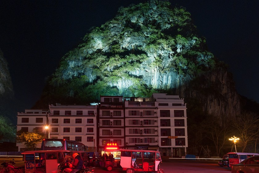 Yángshuò. Illuminated pinnacle at night. Yángshuò. .