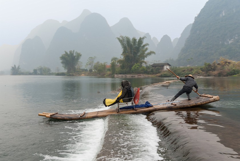 Bicycle Tour Along the Yùlóng Hé River. Raft going over the barrage. Yángshuò. .