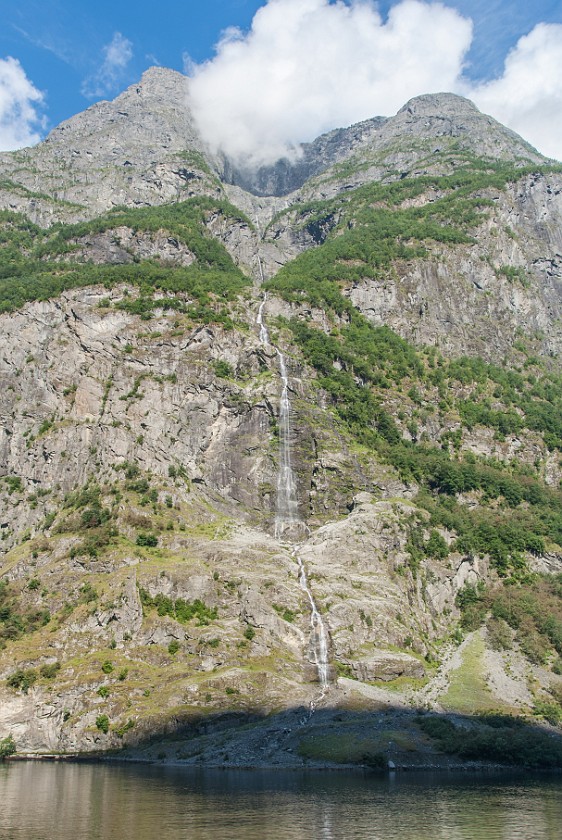 Cruise on the Nærøyfjord. Waterfall. near Gudvangen. .