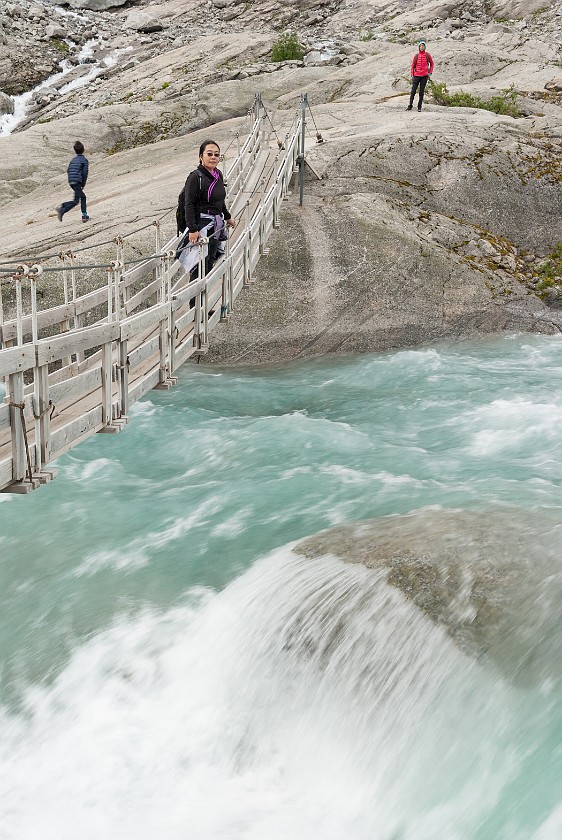 Nigardsbreen Glacier. Suspension bridge over the glacier river. near Gjerde. .