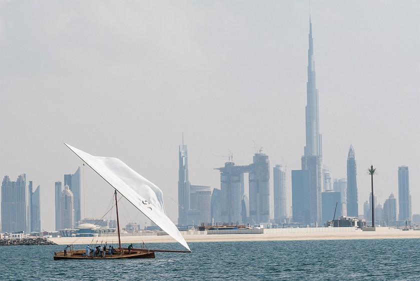 Dubai Skyline. View on Dubai downtown with historic sail boat. Dubai. .
