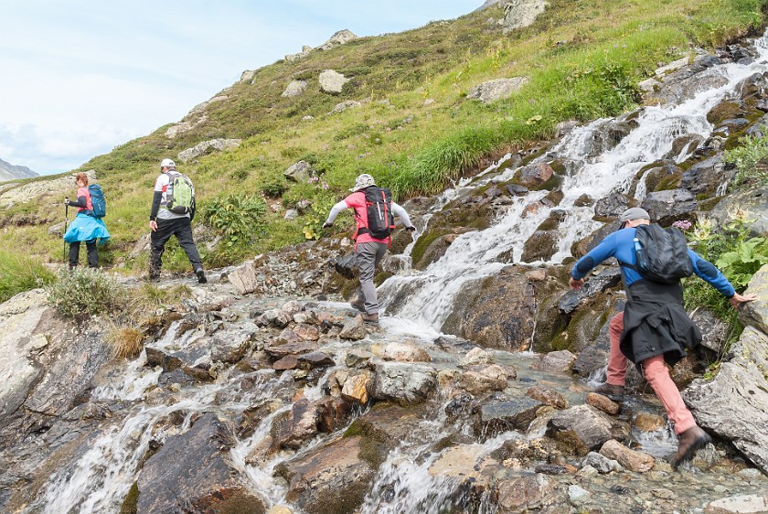 Jamtal Glacier Tour. Crossing the Jam brook. near Galtür. .