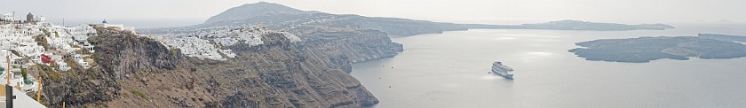 Oia, Santorini. Panoramic view on the caldera of Santorini with cruise ship. Oia. .