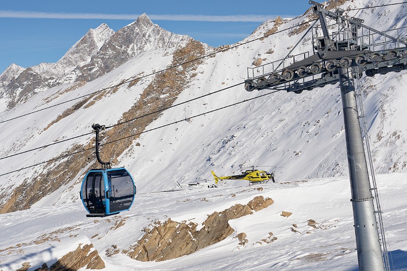 Skiing the Rothorn Area. Helicopters at the Rothorn summit. near Zermatt. .